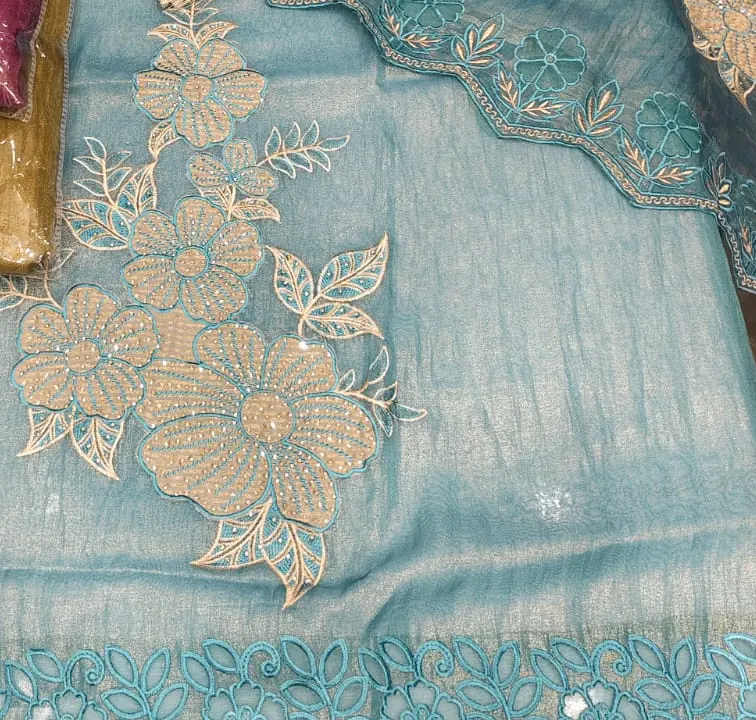 Peach floral embroidery and cutwork on sky blue fabric